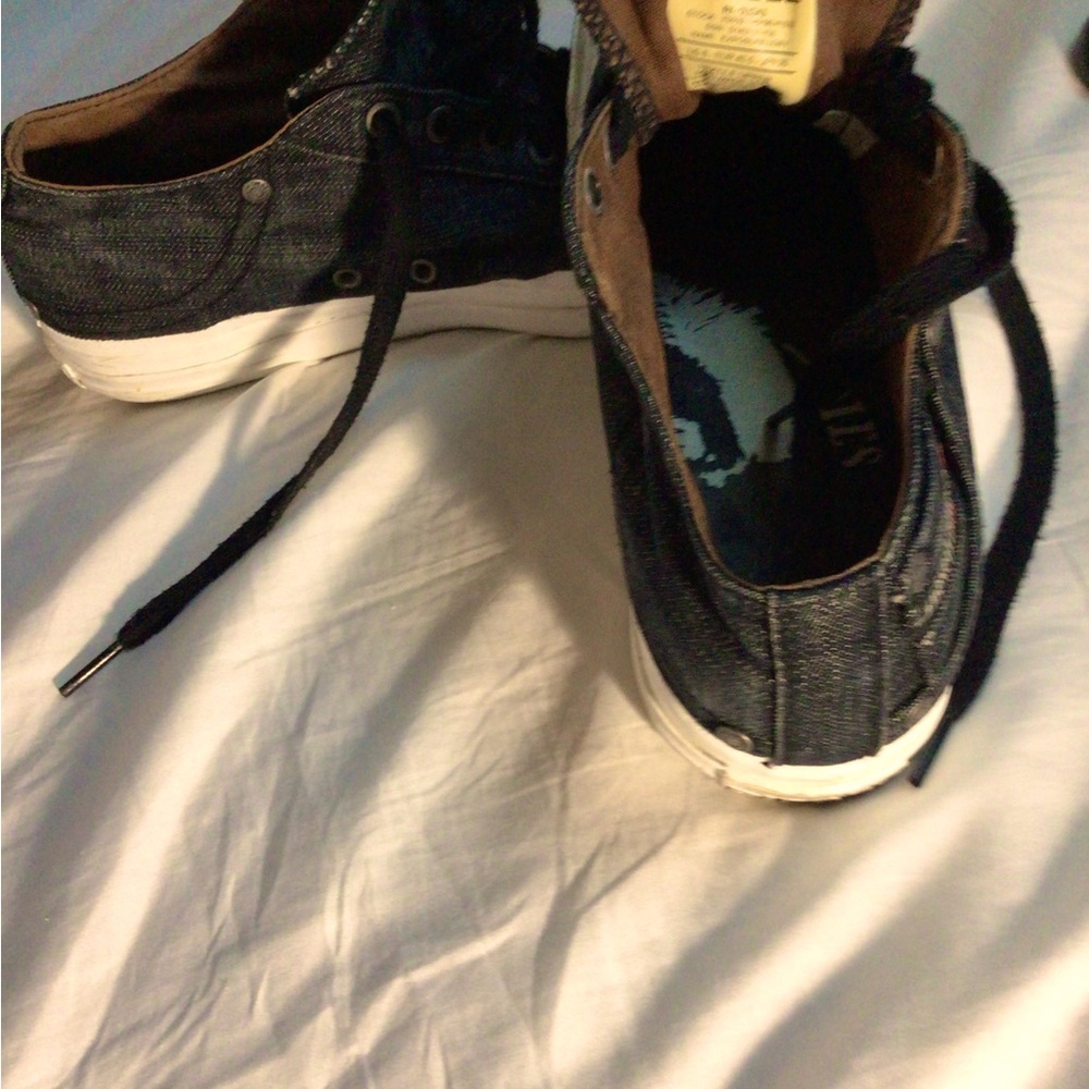 A gently used pair of Diesel tennis shoes, very cool, in black denim. Size US 8